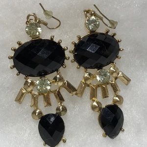 Black rhinestone earrings set in gold tone